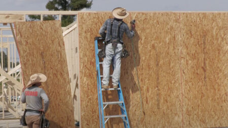 Men building a home