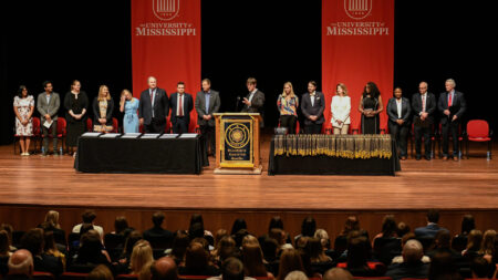 Phi Kappa Phi Ceremony in Ford Center with people standing on stage.