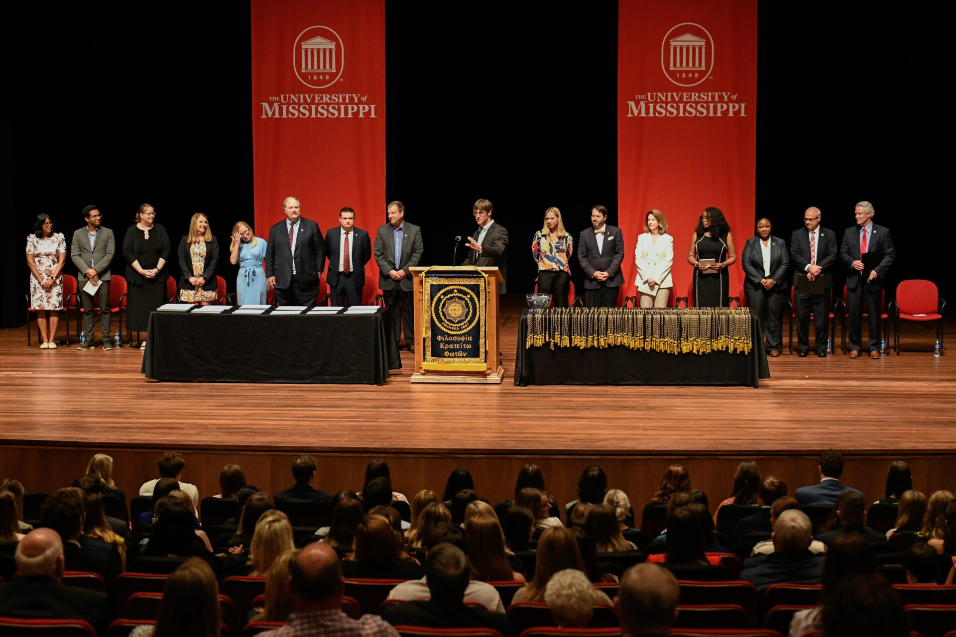 Phi Kappa Phi Ceremony in Ford Center with people standing on stage.