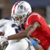 Rebels defensive back John Saunders Jr. tackles Georgia Southern Eagles wide receiver Carmelo Mays