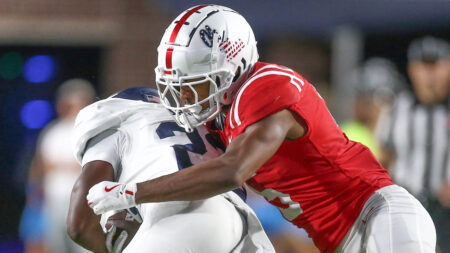 Rebels defensive back John Saunders Jr. tackles Georgia Southern Eagles wide receiver Carmelo Mays