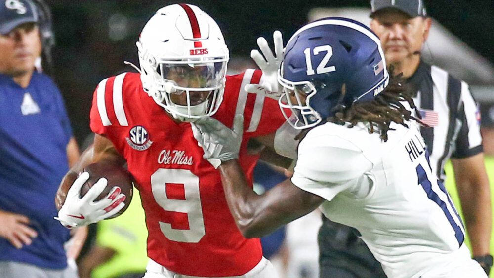 Rebels wide receiver Tre Harris (9) runs after a catch as Georgia Southern Eagles defensive back Tracy Hill Jr. (12) pushes him out of bounds