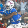 Rebels wide receiver Antwane Wells Jr. catches the ball for a touchdown over Georgia Bulldogs defensive back KJ Bolden