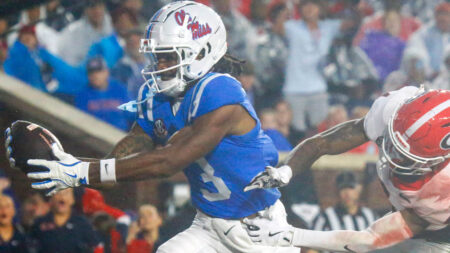 Rebels wide receiver Antwane Wells Jr. catches the ball for a touchdown over Georgia Bulldogs defensive back KJ Bolden