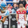 Rebels wide receiver Cayden Lee looks for running room after making a catch against Arkansas