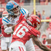 Ole Miss Rebels tight end Dae'Quan Wright takes a hit from Arkansas Razorbacks defensive back Miguel Mitchell