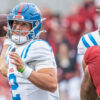 Rebels quarterback Jaxson Dart throws a pass against Arkansas