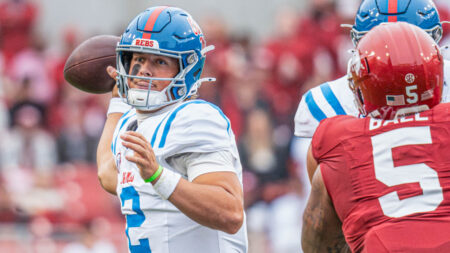 Rebels quarterback Jaxson Dart throws a pass against Arkansas