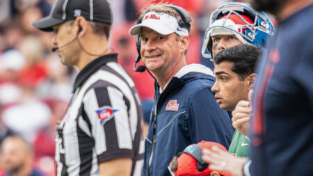 Rebels coach Lane Kiffin on the sidelines against Arkansas