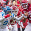 Ole Miss Rebels cornerback Trey Amos dives to try and stop Arkansas Razorbacks quarterback Malachi Singleton