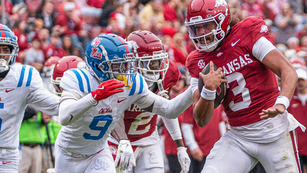 Ole Miss Rebels cornerback Trey Amos dives to try and stop Arkansas Razorbacks quarterback Malachi Singleton