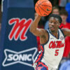 Ole Miss Rebels guard Jaylen Murray passes the ball as he jumps over Long Island Sharks guard Brent Davis