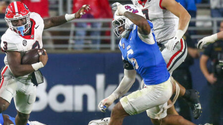 Georgia running back Nate Frazier (3) runs the ball as Ole Miss Rebels linebacker TJ Dottery (6) pursues