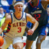 Rebels guard Sean Pedulla (3) drives to the basket as South Alabama forward Barry Dunning Jr. (22) defends