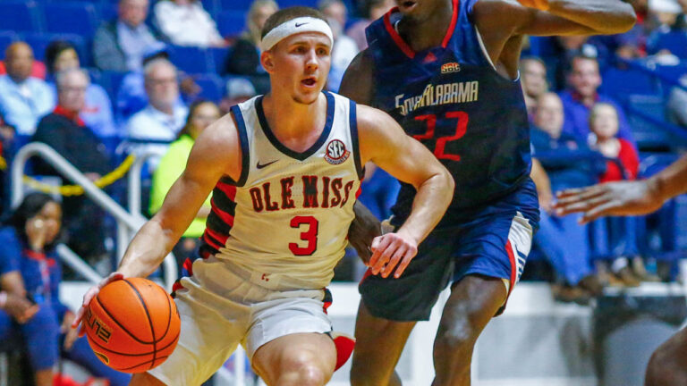 Rebels guard Sean Pedulla (3) drives to the basket as South Alabama forward Barry Dunning Jr. (22) defends