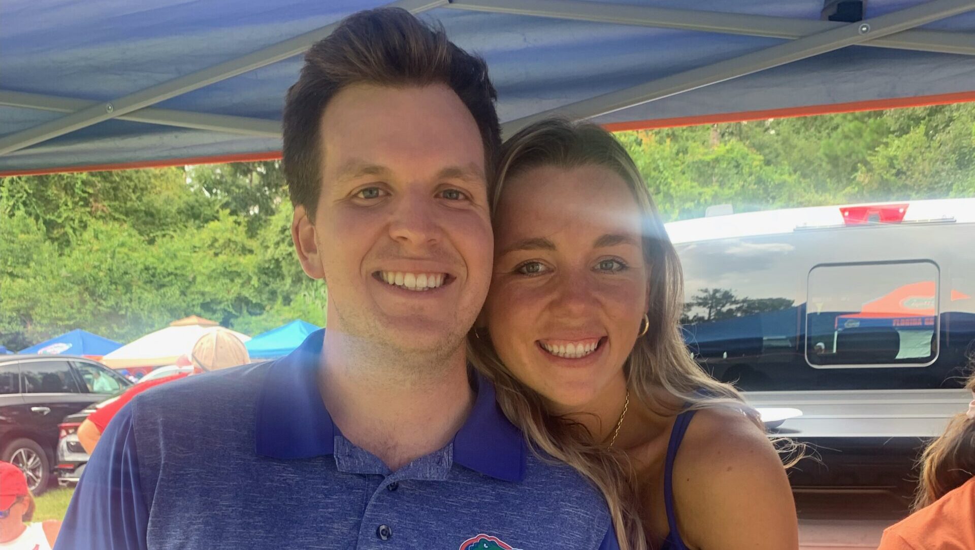 Shane Brown and Frances Buchanan under a tent at a sports event