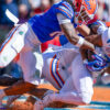 Ole Miss Rebels wide receiver Tre Harris (9) makes a catch for a touchdown over Florida Gators defensive back Bryce Thornton (18)