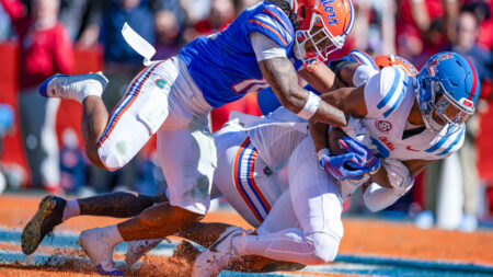 Ole Miss Rebels wide receiver Tre Harris (9) makes a catch for a touchdown over Florida Gators defensive back Bryce Thornton (18)