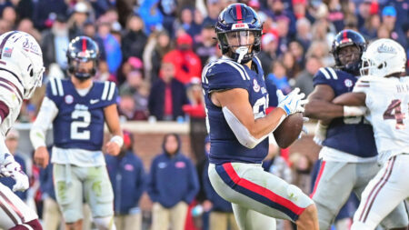 Rebels tight end Caden Prieskorn (86) runs the ball while defended by Mississippi State Bulldogs safety Hunter Washington (21)