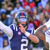 Rebels quarterback Jaxson Dart (2) looks to pass while defended by Mississippi State linebacker Branden Jennings (44)