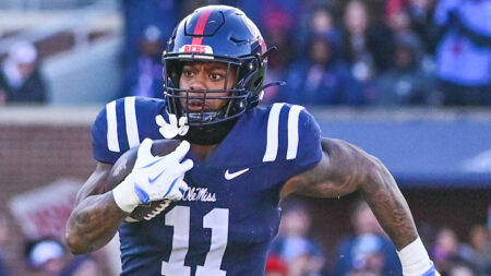 Rebels linebacker Chris Paul Jr. (11) runs the ball after an interception against Mississippi State