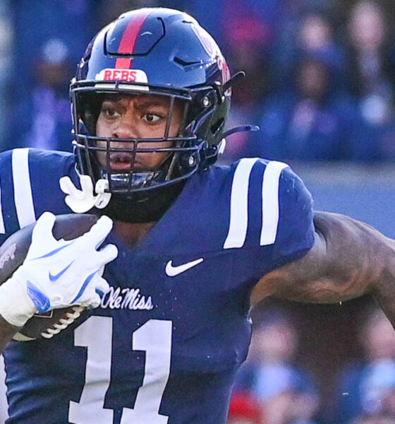 Rebels linebacker Chris Paul Jr. (11) runs the ball after an interception against Mississippi State