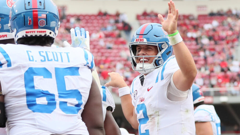 Ole Miss defensive tackle JJ Pegues (89) celebrates with quarterback Jaxson Dart (2) after scoring a rushing touchdown in the third quarter against the Arkansas