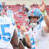 Ole Miss defensive tackle JJ Pegues (89) celebrates with quarterback Jaxson Dart (2) after scoring a rushing touchdown in the third quarter against the Arkansas