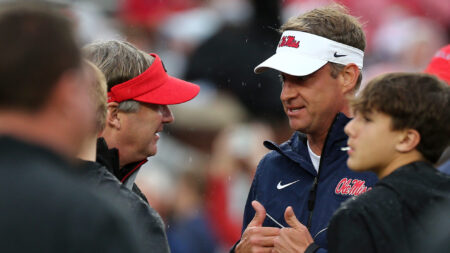 Georgia coach Kirby Smart and Ole Miss coach Lane Kiffin talk prior to the game