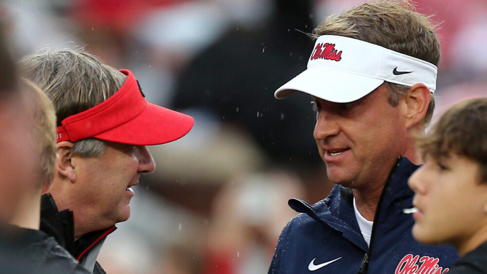 Georgia coach Kirby Smart and Ole Miss coach Lane Kiffin talk prior to the game