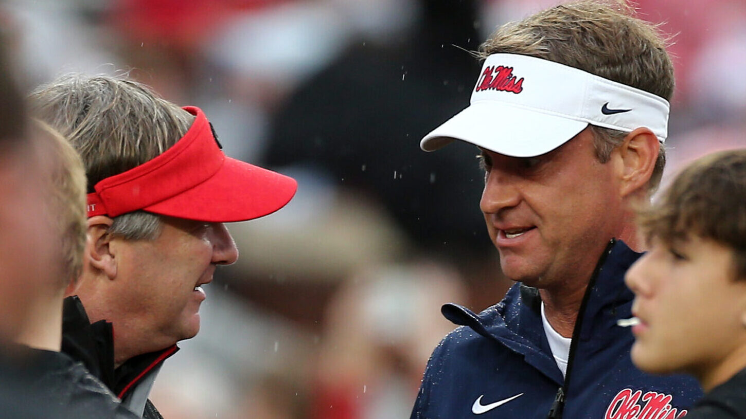 Georgia coach Kirby Smart and Ole Miss coach Lane Kiffin talk prior to the game