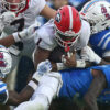 Georgia running back Trevor Etienne (1) runs the ball as Ole Miss defensive back Trey Amos makes the tackle