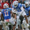 Ole Miss defensive back John Saunders Jr. (5) reacts with linebacker Chris Paul Jr. (11) after a defensive stop during the first half against Georgia