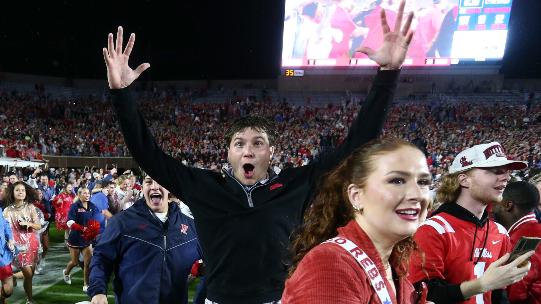 Rebels fans rush the field after defeating Georgia