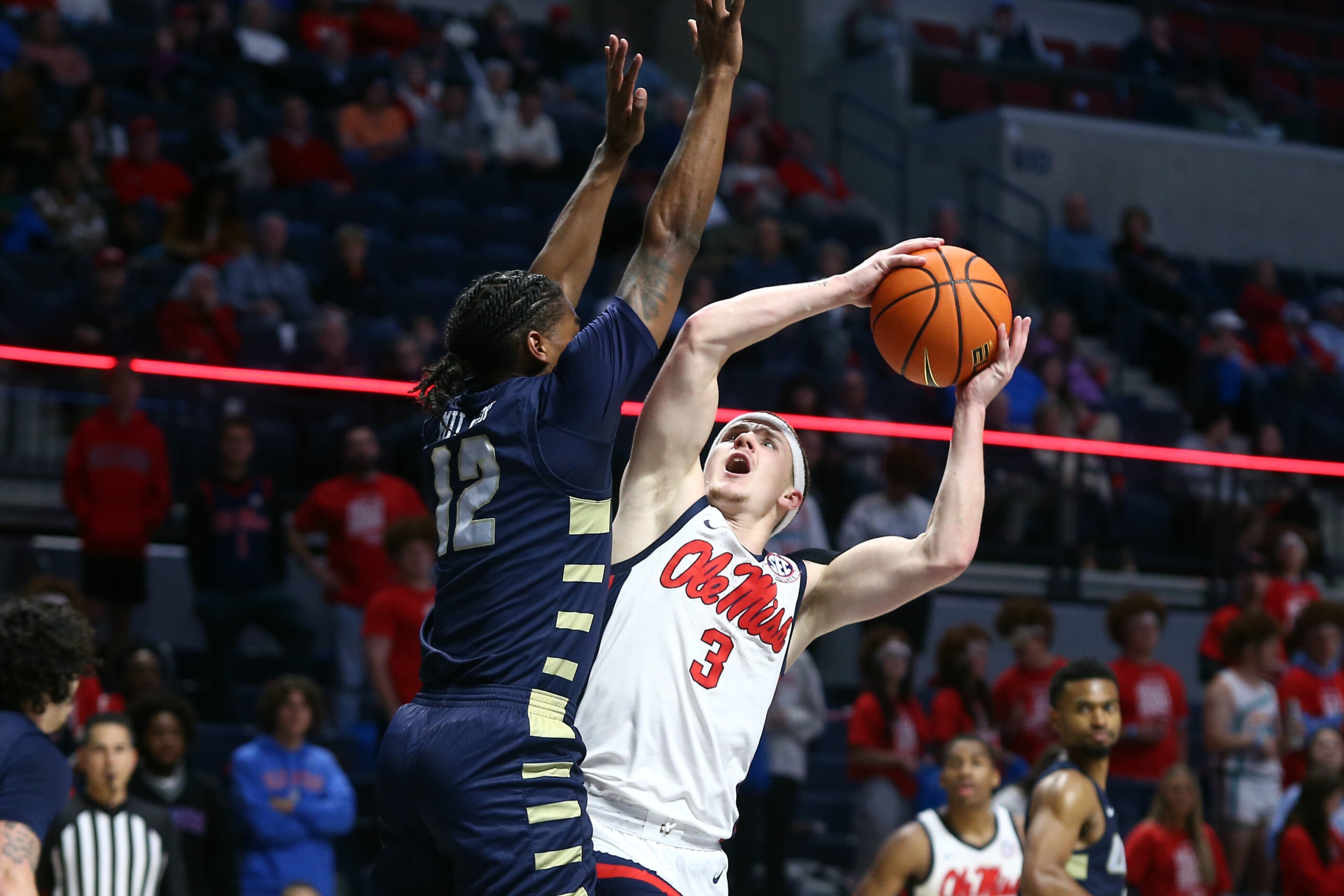 Ole Miss Rebels guard Sean Pedulla (3) shoots as Oral Roberts guard Jalen Miller (12) defends