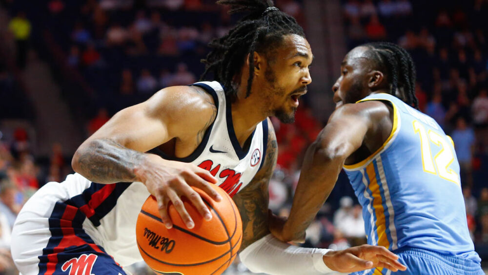 Ole Miss Rebels guard Dre Davis (14) drives to the basket as Long Island Sharks guard Brent Davis (12)