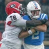 Georgia Bulldogs defensive lineman Nazir Stackhouse tackles Ole Miss Rebels quarterback Jaxson Dart