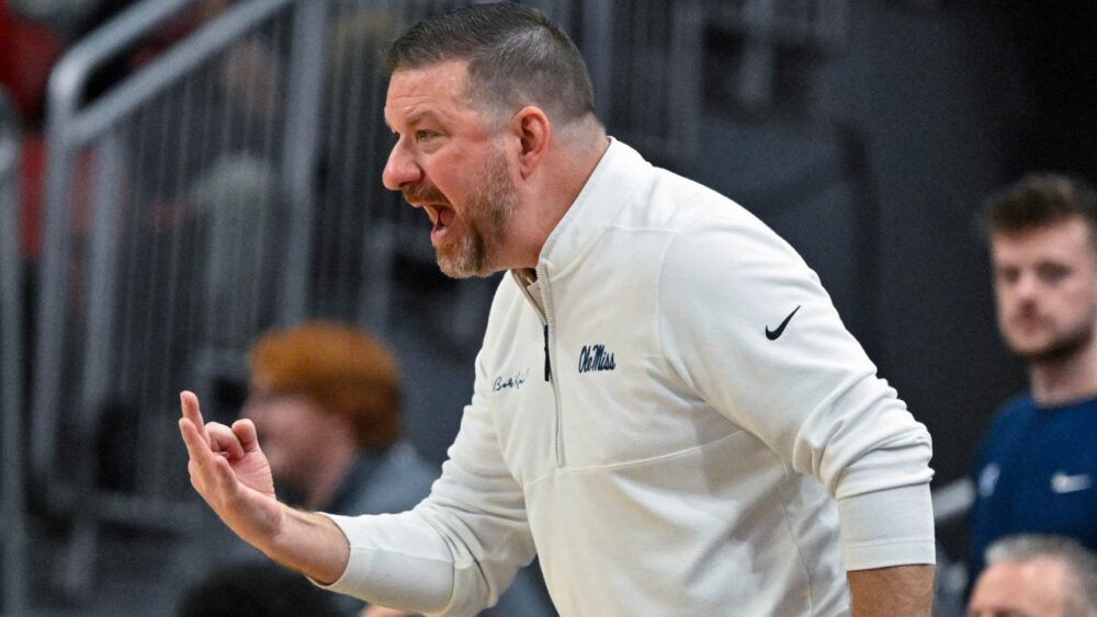 Ole Miss Rebels coach Chris Beard calls out instructions during the second half against the Louisville Cardinals