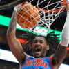 Ole Miss Rebels guard Dre Davis (14) dunks against the Louisville Cardinals