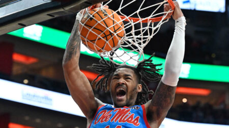 Ole Miss Rebels guard Dre Davis (14) dunks against the Louisville Cardinals