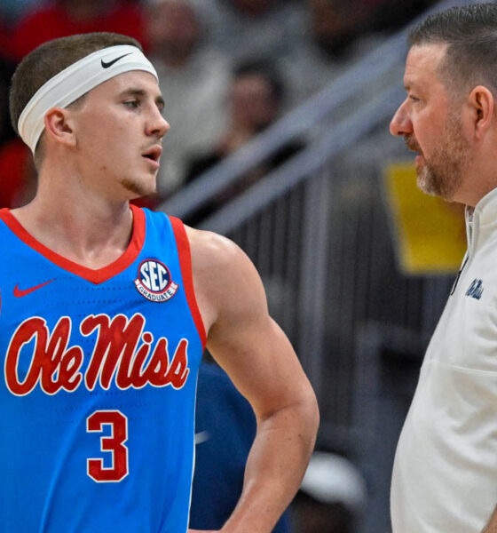 Ole Miss Rebels coach Chris Beard talks with guard Sean Pedulla (3) during the second half against the Louisville Cardinals